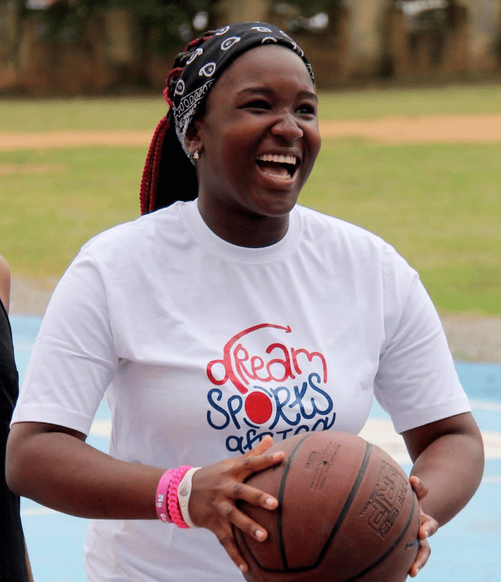 girl smiling with basketball